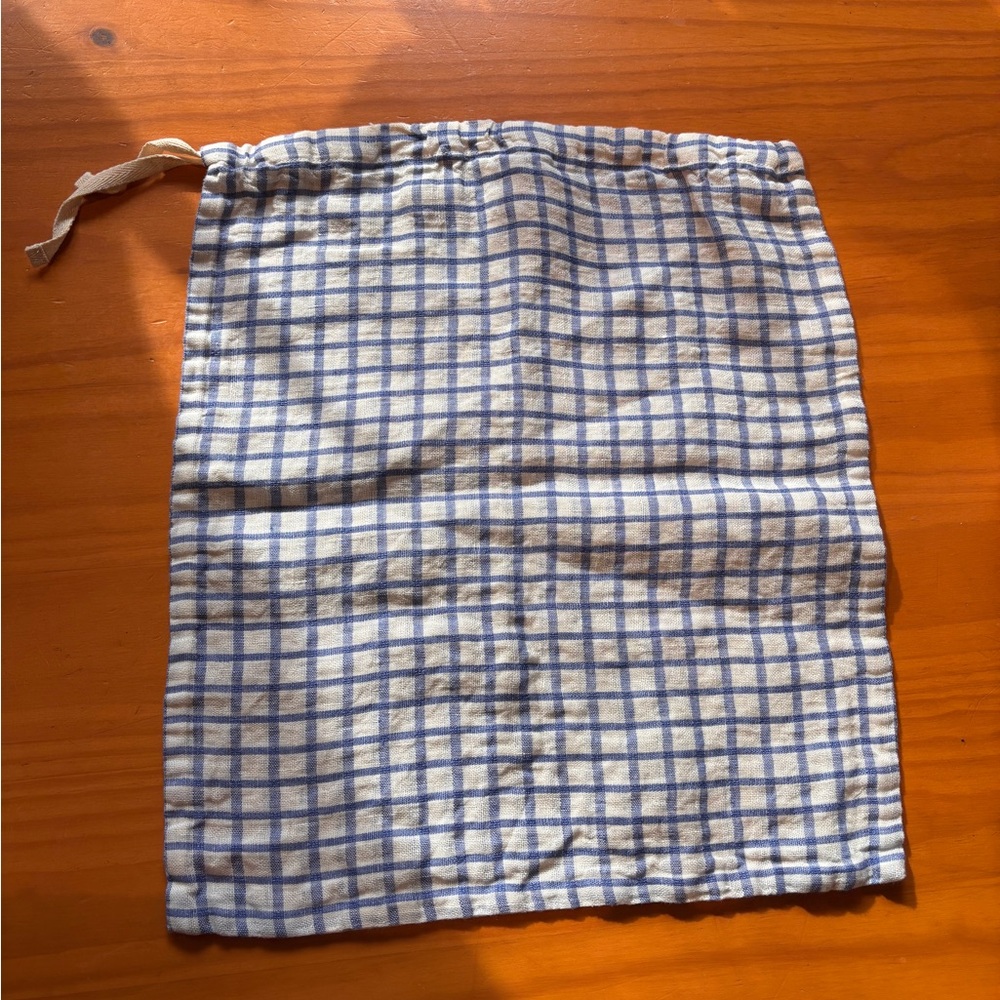 NPL Blue and White Checked Drawstring bag.